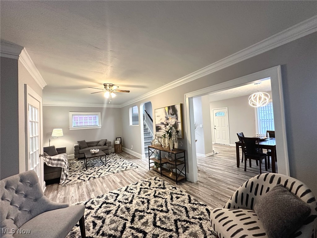 3393 Kildare Road Cleveland, OH 44118 - Photo 2 of 15 Living room with light hardwood / wood-style floors, ceiling fan, and crown molding