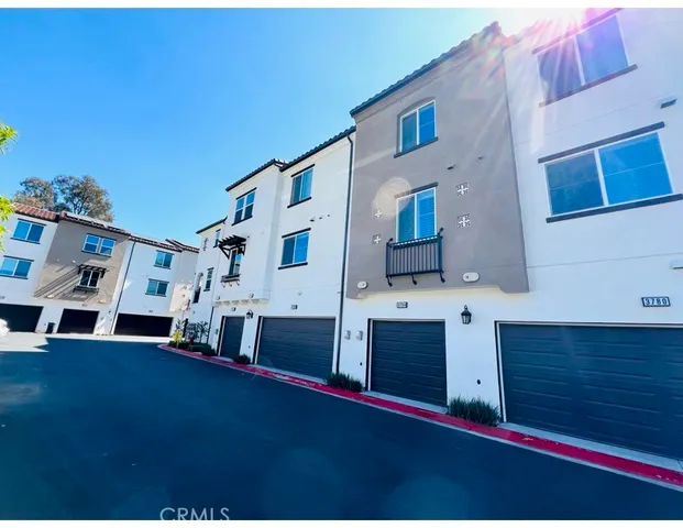 a view of a patio with table and chairs and potted plants