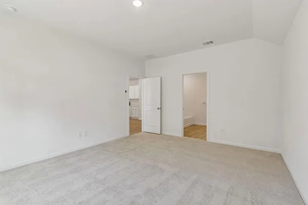 a bathroom with a shower and toilet