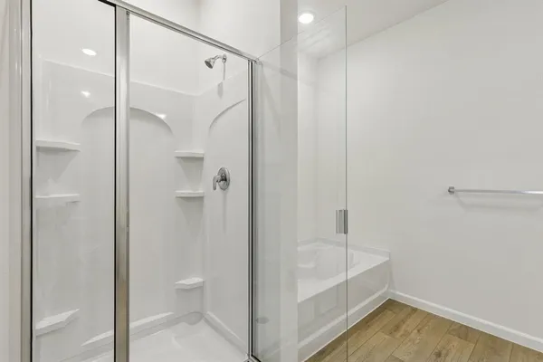 a bathroom with a bathtub and a shower