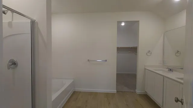 a bathroom with a sink and shower