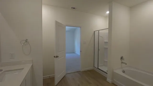 a bathroom with a shower and toilet