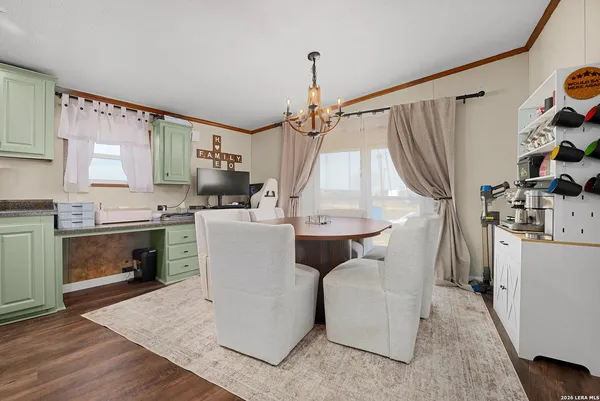 a kitchen with sink a refrigerator and cabinets