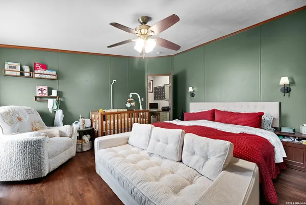 a bedroom with a bed and a chandelier