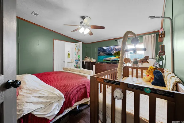 a bedroom with furniture and a chandelier