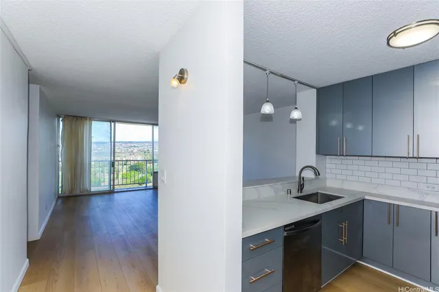 a kitchen with a sink and a window