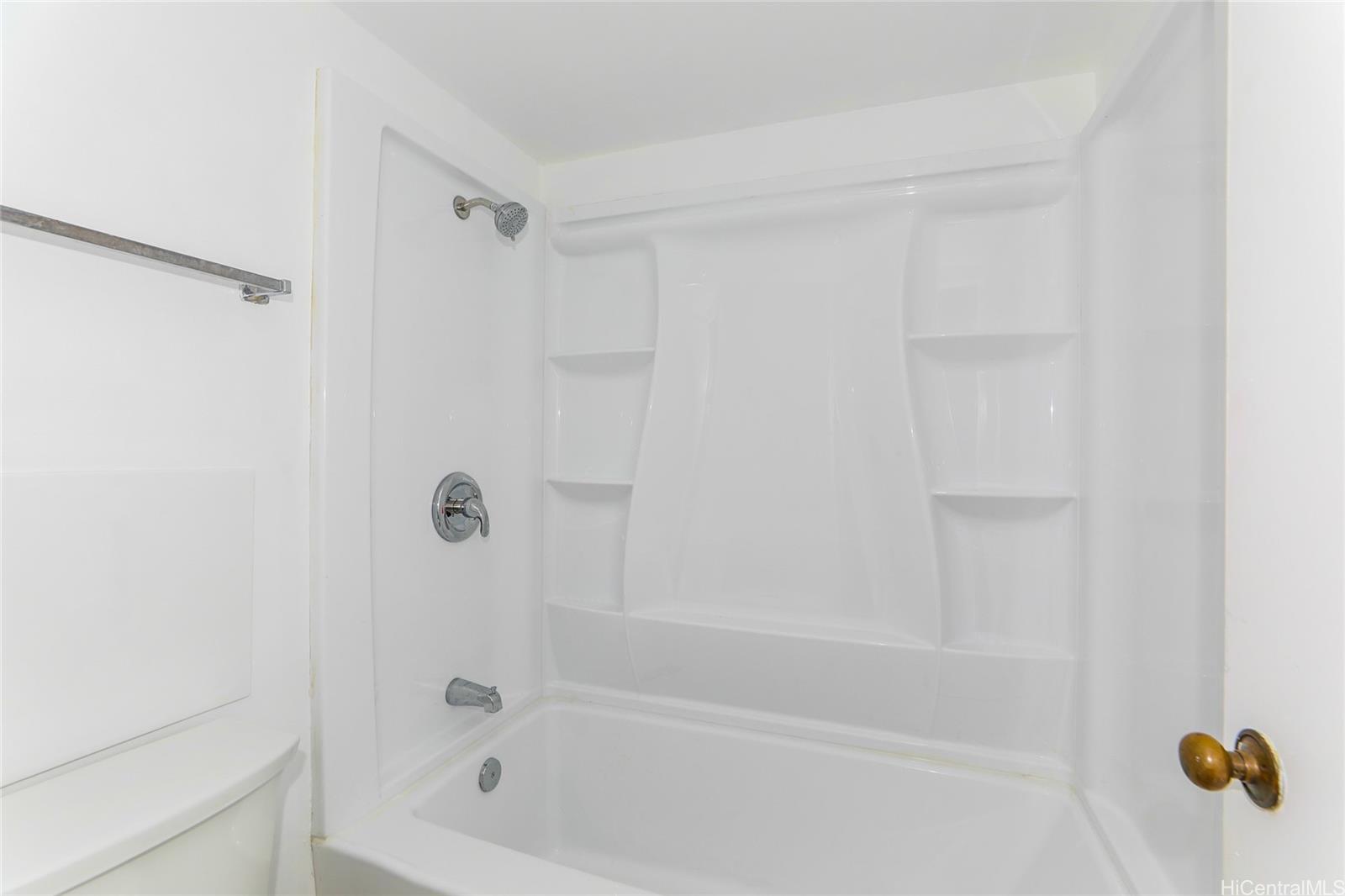 98-410 Koauka Loop, Unit 32C Aiea, HI 96701 - Photo 15 of 25 a bathroom with a shower