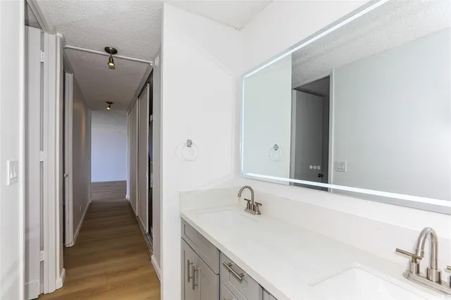 a bathroom with a sink and mirror