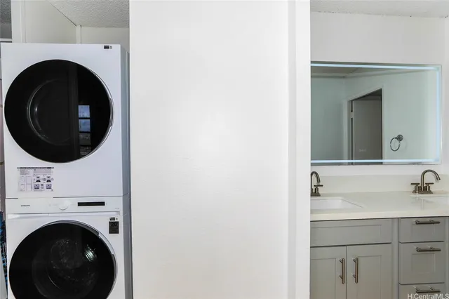 a bathroom with a sink and a washer