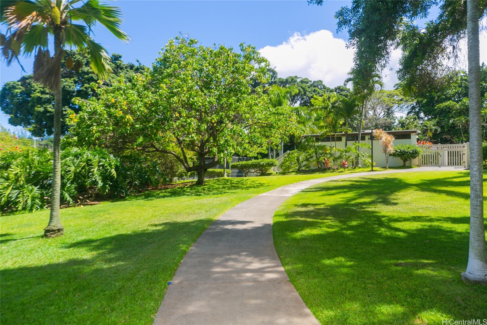 98-410 Koauka Loop, Unit 32C Aiea, HI 96701 - Photo 19 of 25 a view of a park with large trees