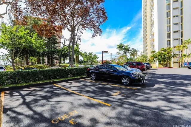 a view of street with parked cars