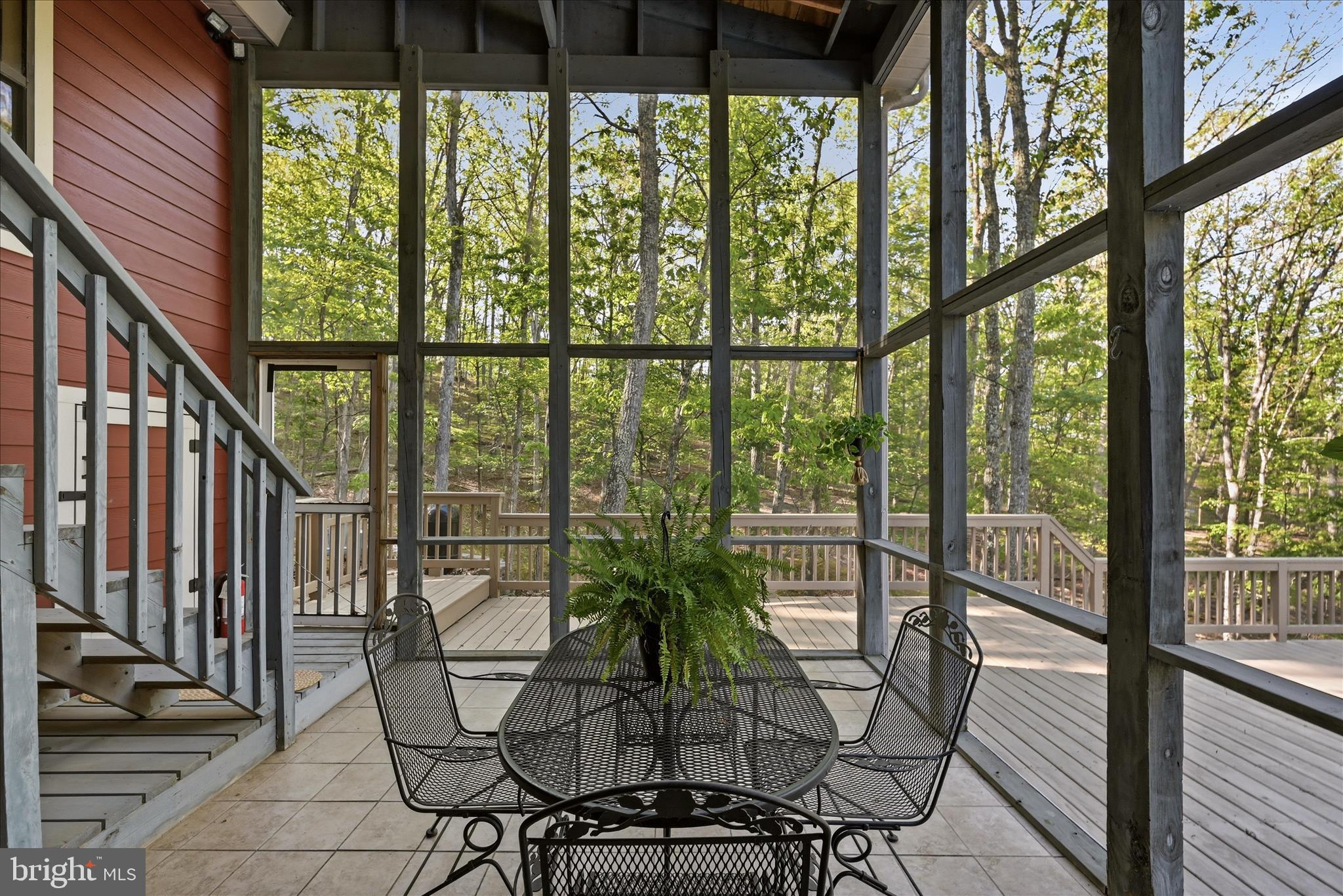 1856 Crossings View Road Paw Paw, WV 25434 - Photo 34 of 45 a view of a chairs and table in the balcony