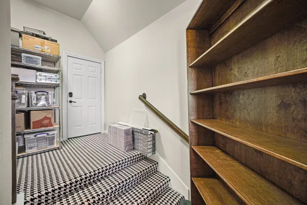 a view of a hallway with seating area