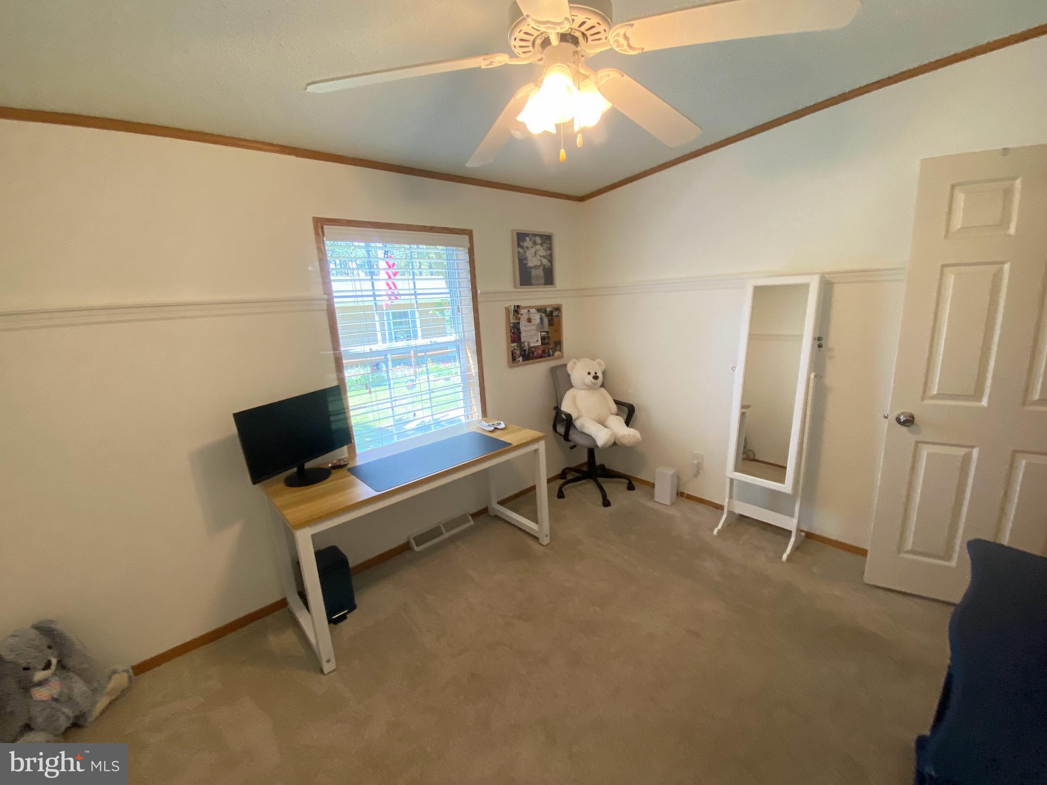 26750 North Rim Road, Unit 975 Long Neck, DE 19966 - Photo 21 of 44 a view of a workspace with furniture and a window