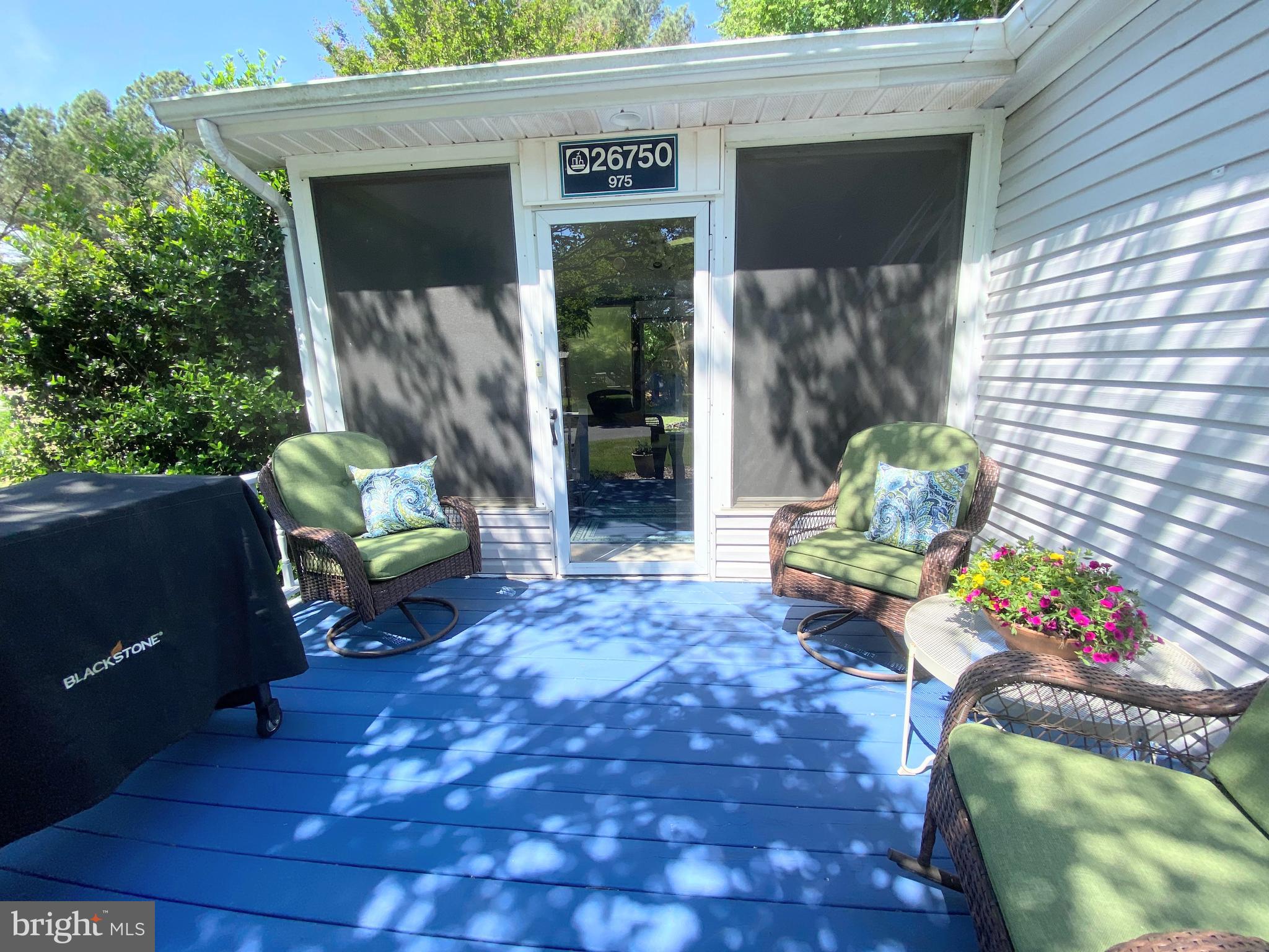26750 North Rim Road, Unit 975 Long Neck, DE 19966 - Photo 3 of 44 a view of a house with a patio