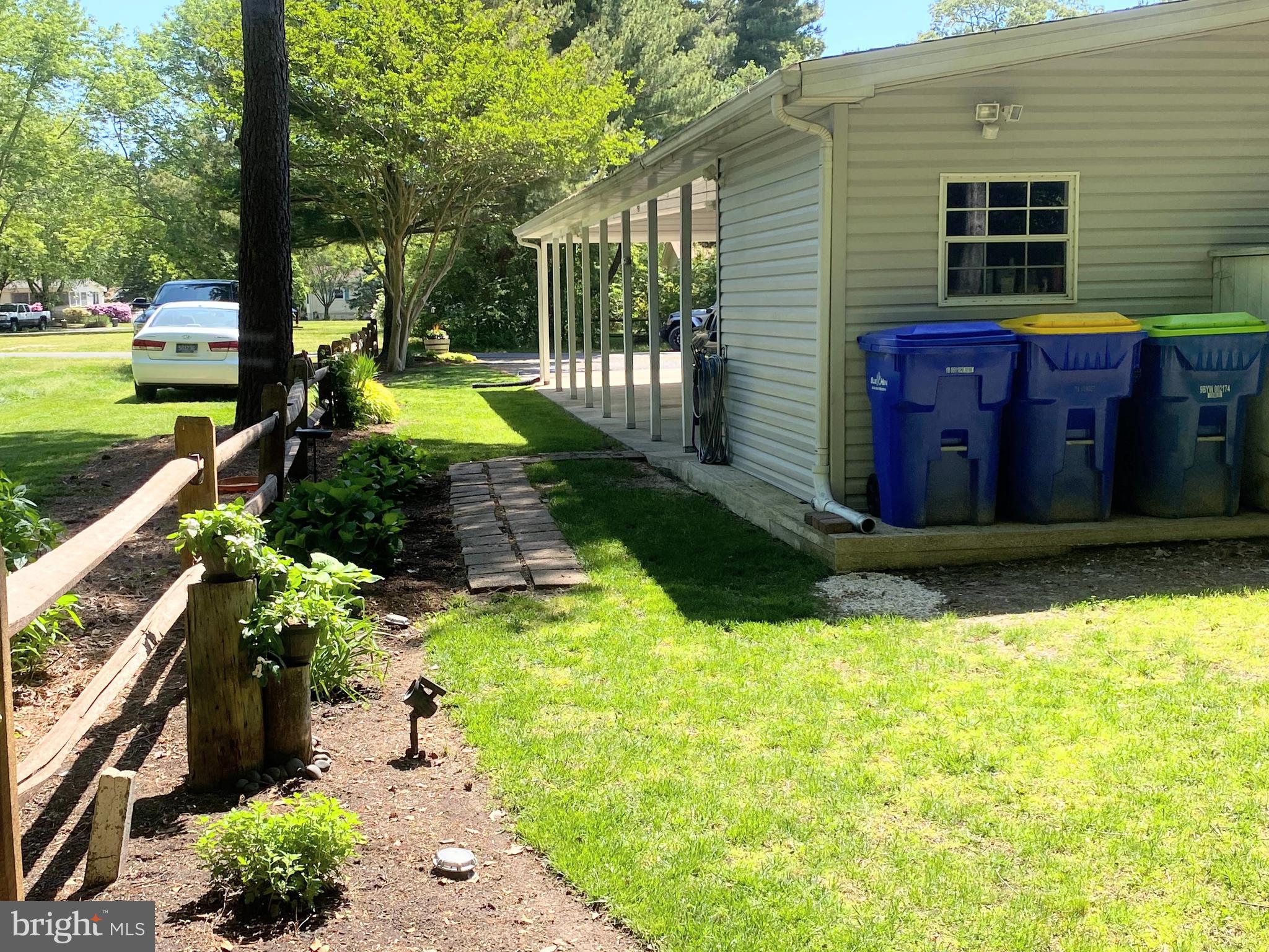 26750 North Rim Road, Unit 975 Long Neck, DE 19966 - Photo 31 of 44 a view of a backyard with pathway