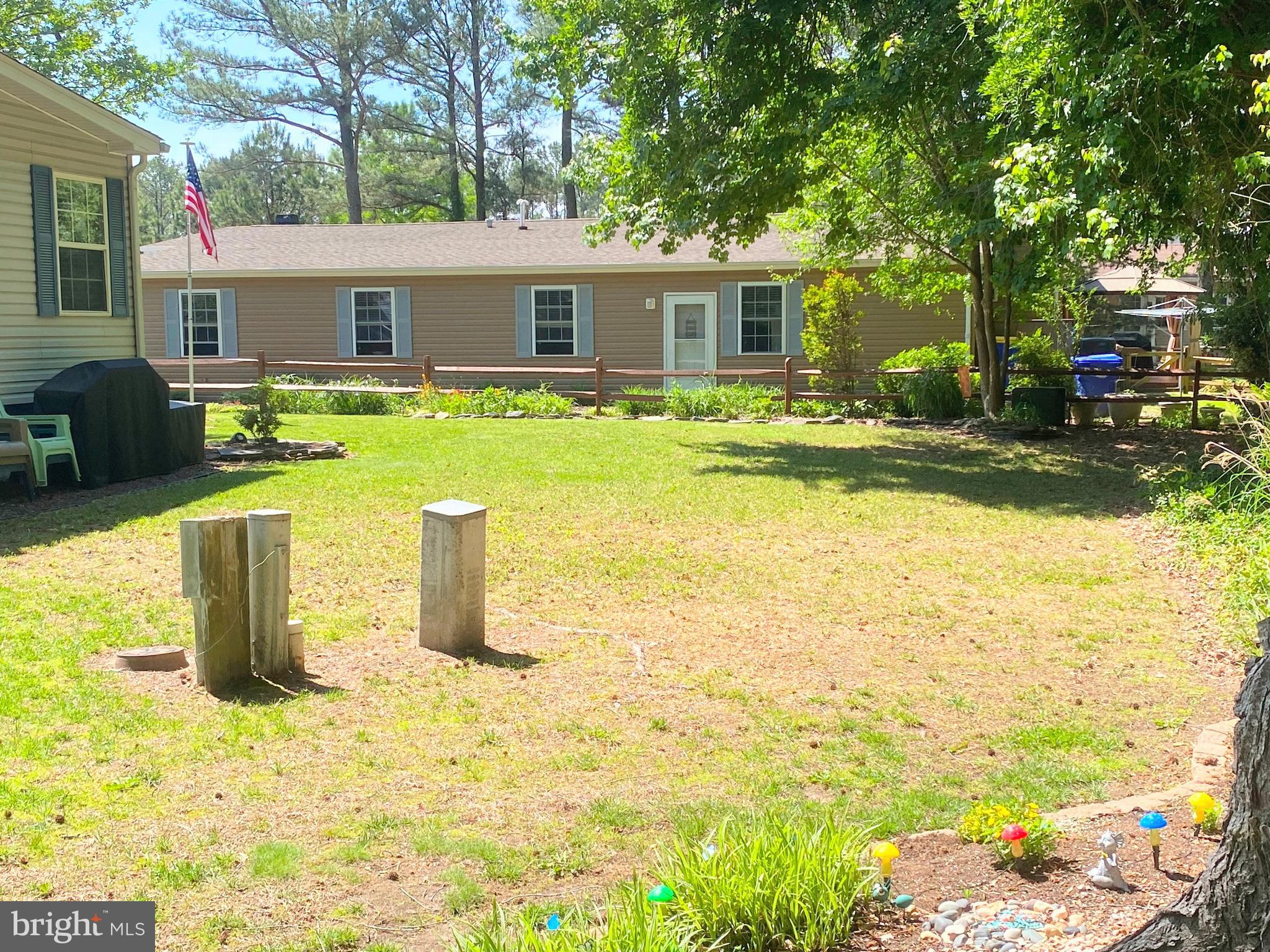 26750 North Rim Road, Unit 975 Long Neck, DE 19966 - Photo 33 of 44 a view of a house with swimming pool