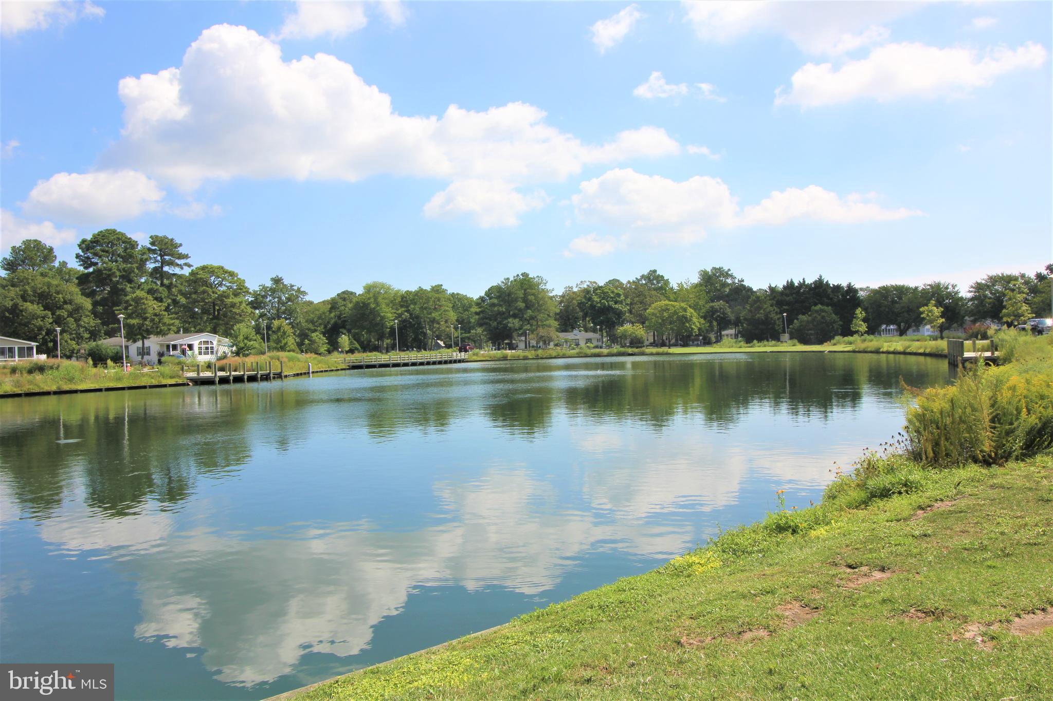 26750 North Rim Road, Unit 975 Long Neck, DE 19966 - Photo 37 of 44 a view of a lake with a city