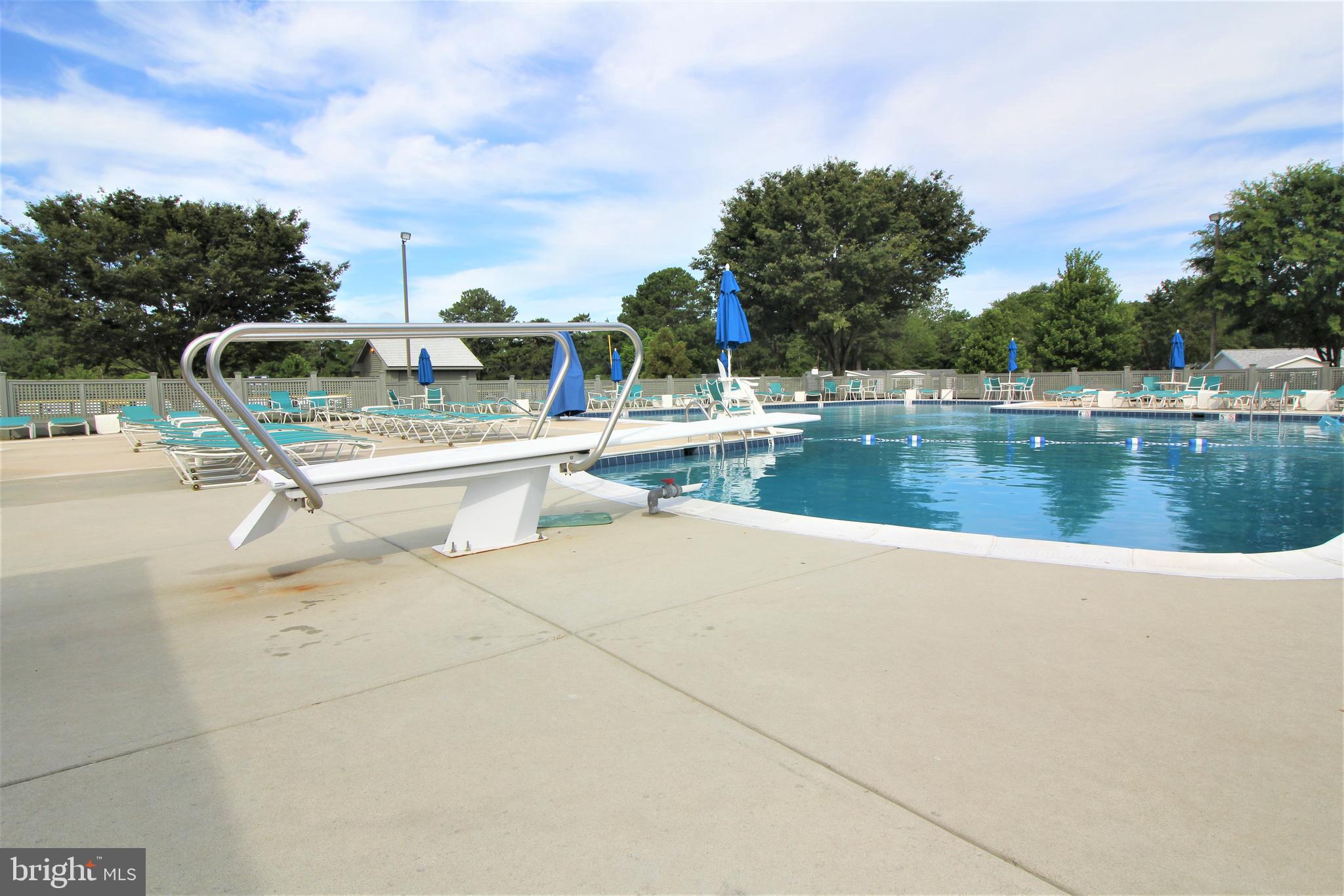 26750 North Rim Road, Unit 975 Long Neck, DE 19966 - Photo 41 of 44 a view of a lake with a sitting space