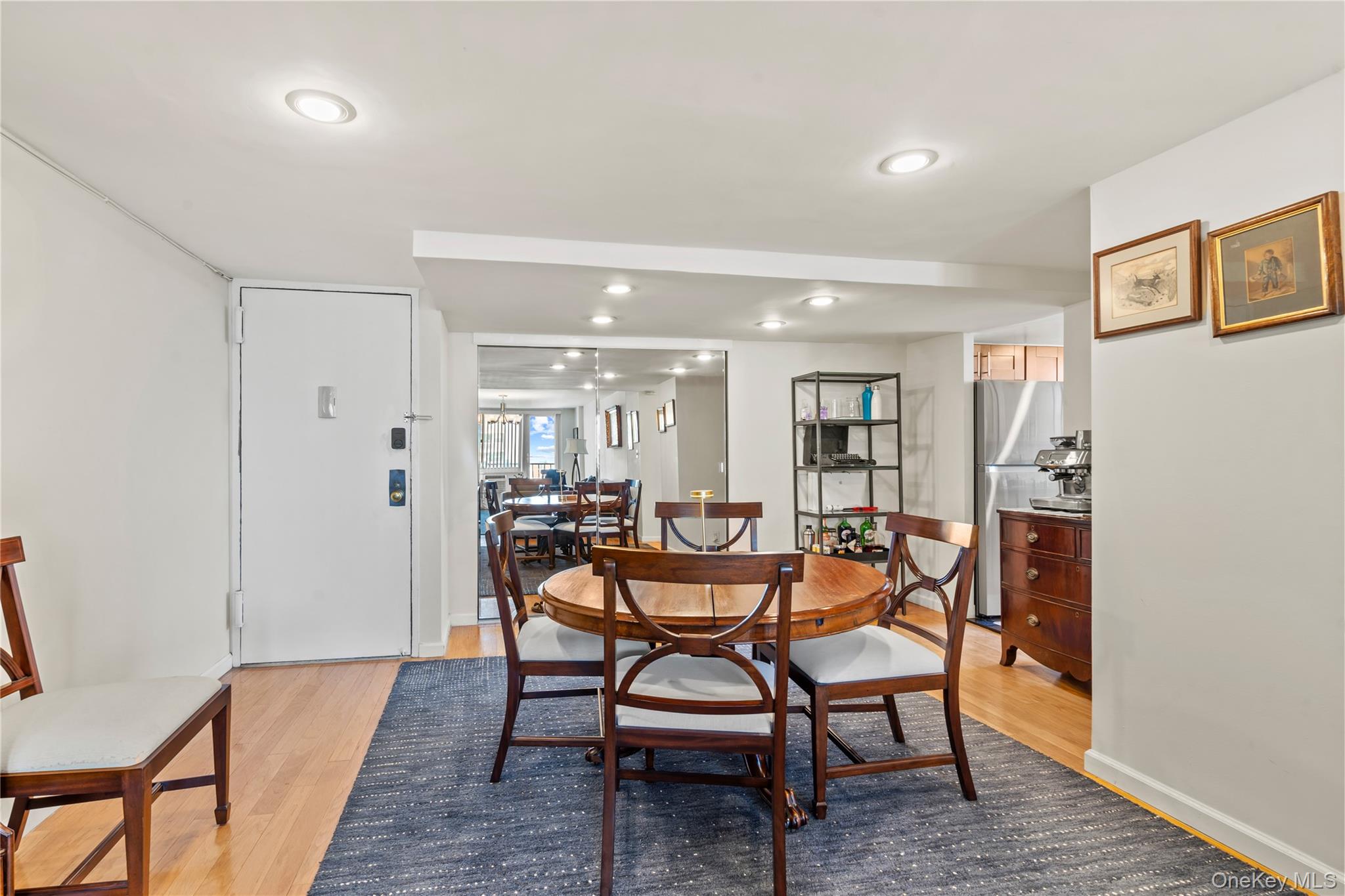 118-18 Union Turnpike, Unit 19G Queens, NY 11415 - Photo 3 of 16 Dining area with light wood-style floors and recessed lighting