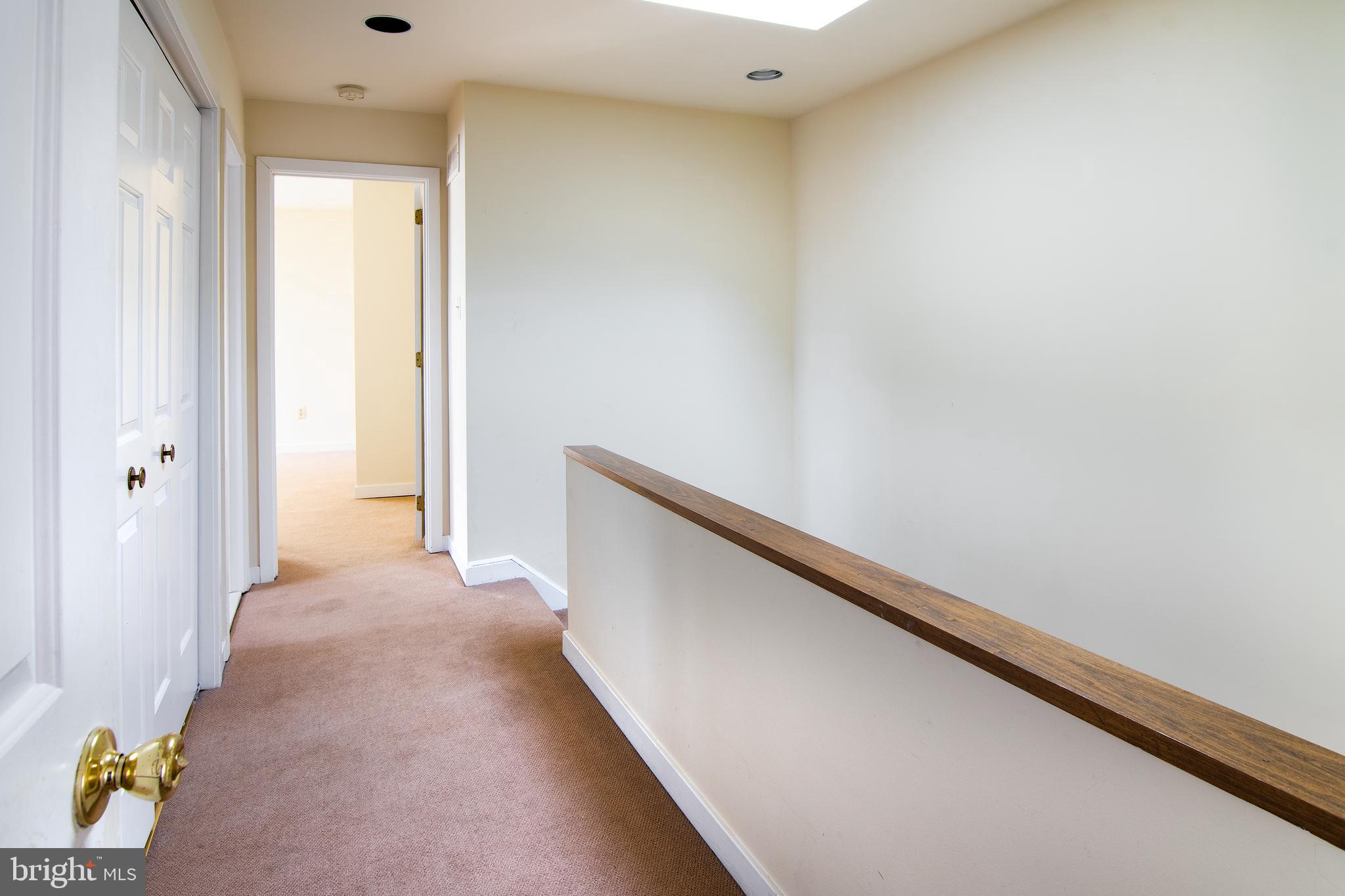 10 Llanfair Road, Unit 6 Ardmore, PA 19003 - Photo 27 of 35 3rd Floor Hall with skylight open to first level