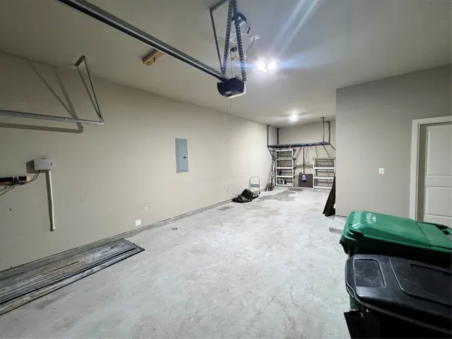 a view of a yard with a large tree and a table in it