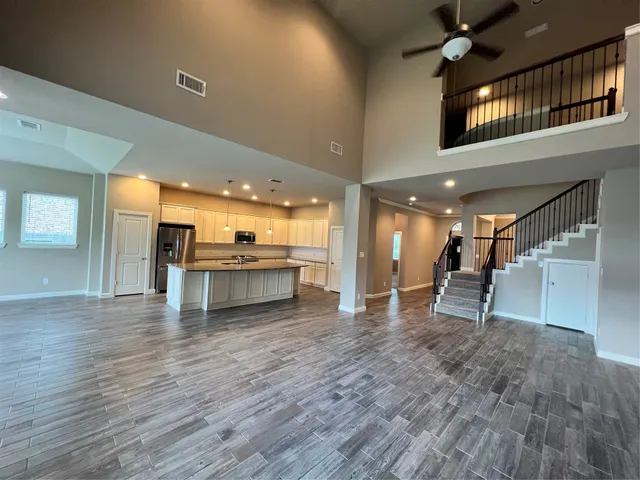 a view of a kitchen with a sink and a floor to ceiling window