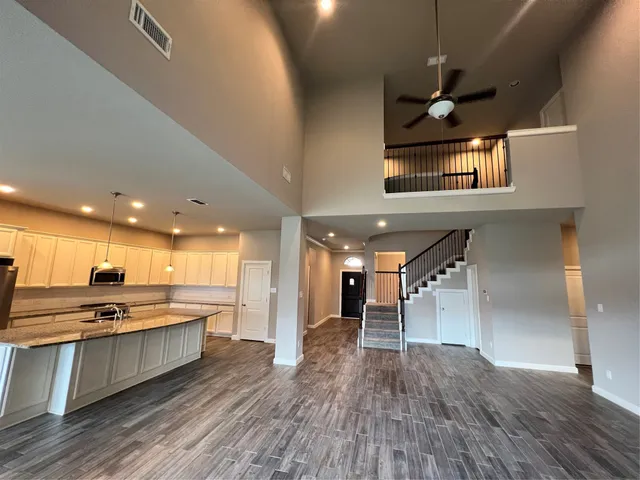 a view of kitchen with cabinets and wooden floor