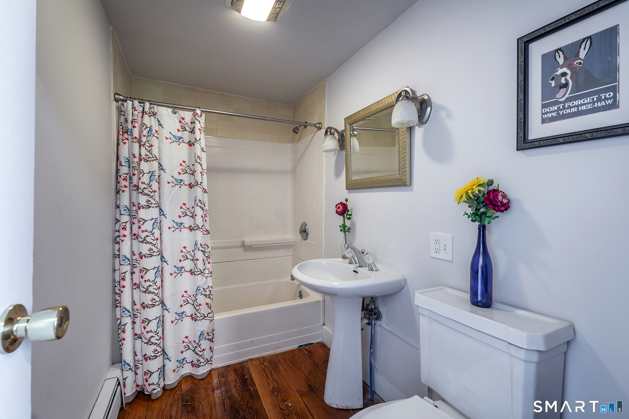 25 Bald Hill Road Kent, CT 06785 - Photo 17 of 38 A full first-floor bathroom conveniently serves both guests and the second bedroom, which features beautiful honey wide wood floors.