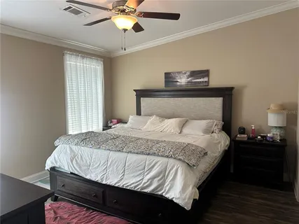 a bedroom with bed and window