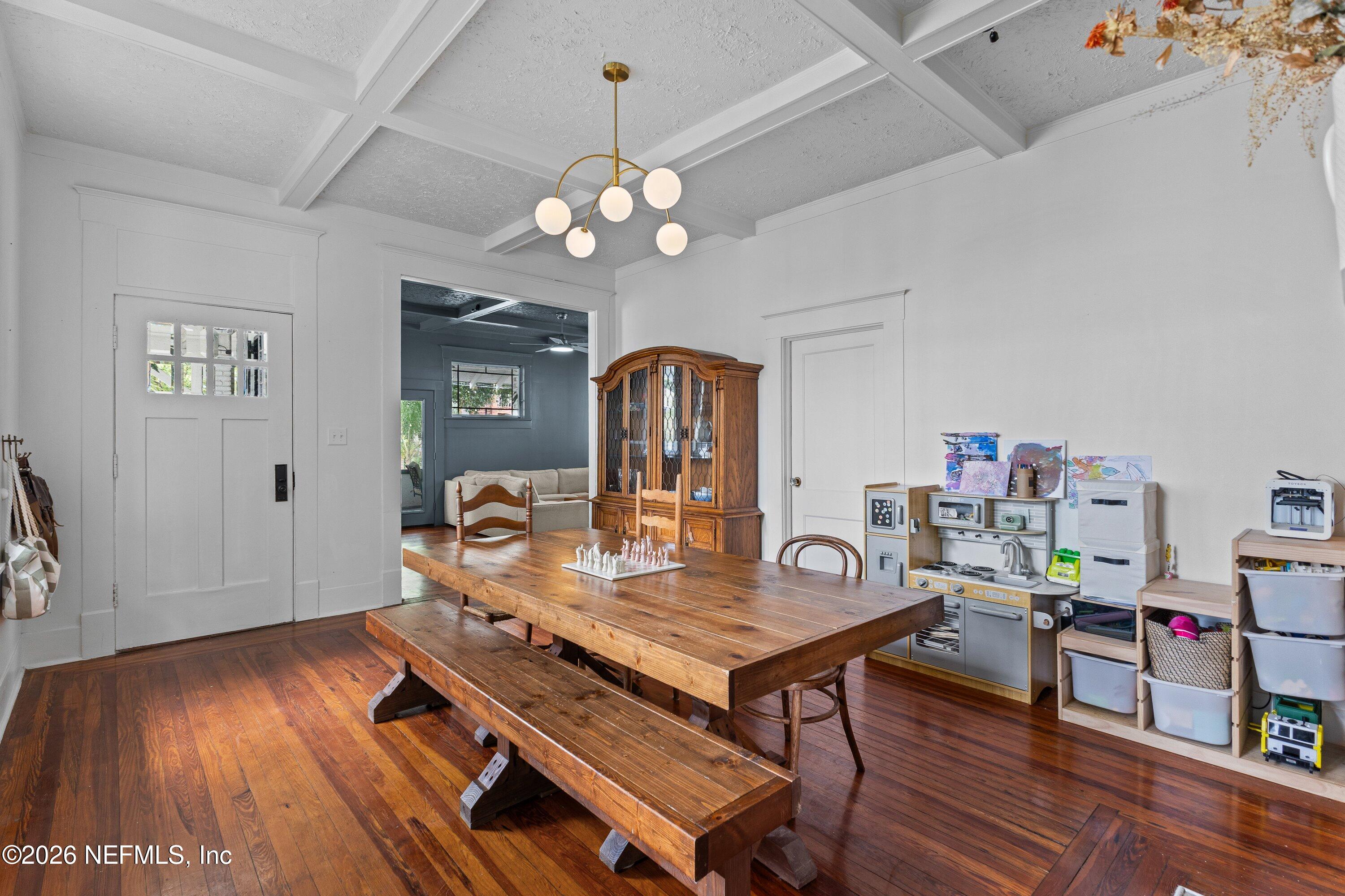 1544 Perry Street Jacksonville, FL 32206 - Photo 18 of 43 a view of a dining room with furniture wooden floor and chandelier