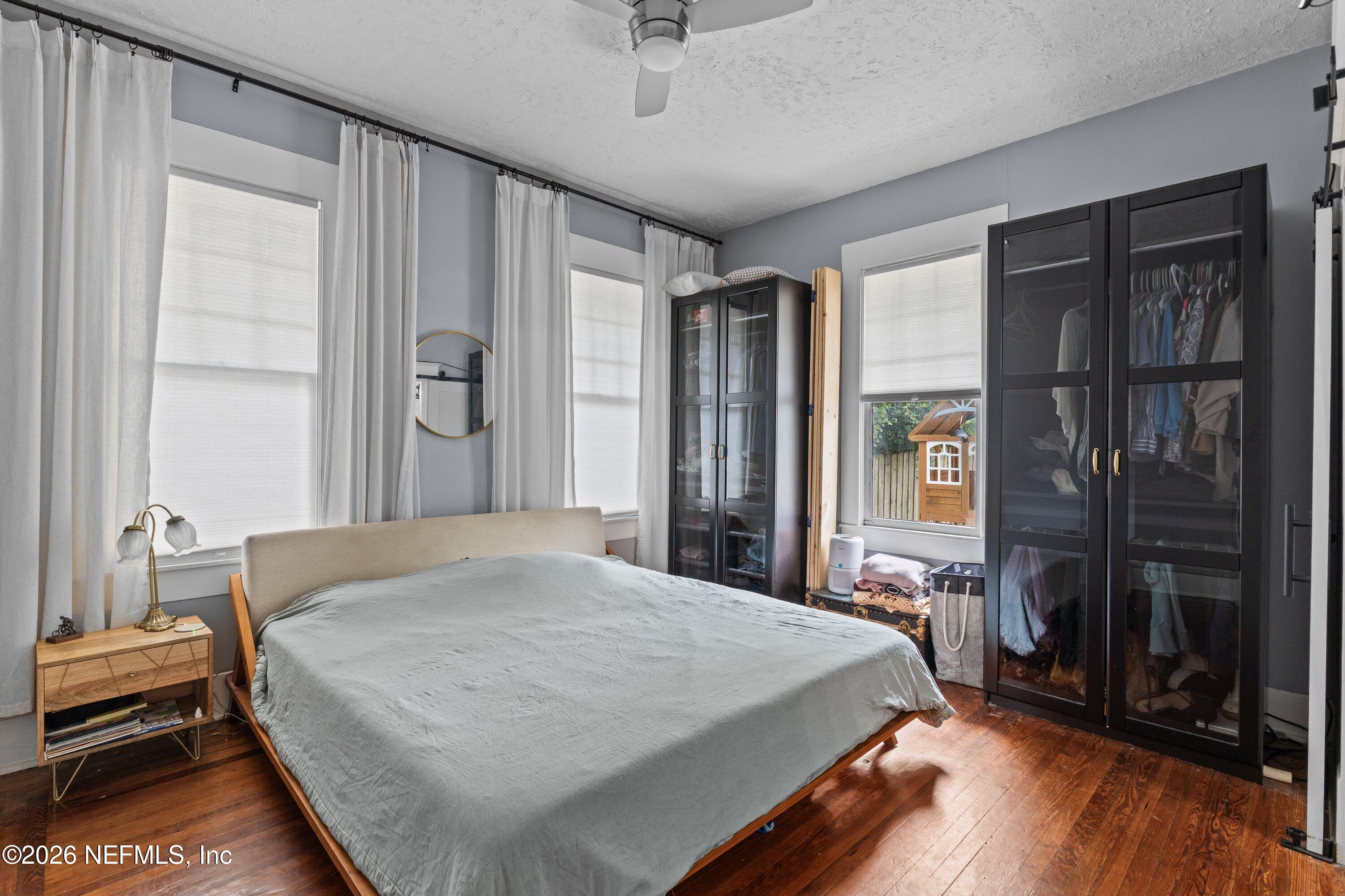 1544 Perry Street Jacksonville, FL 32206 - Photo 21 of 43 a bedroom with a bed and a window