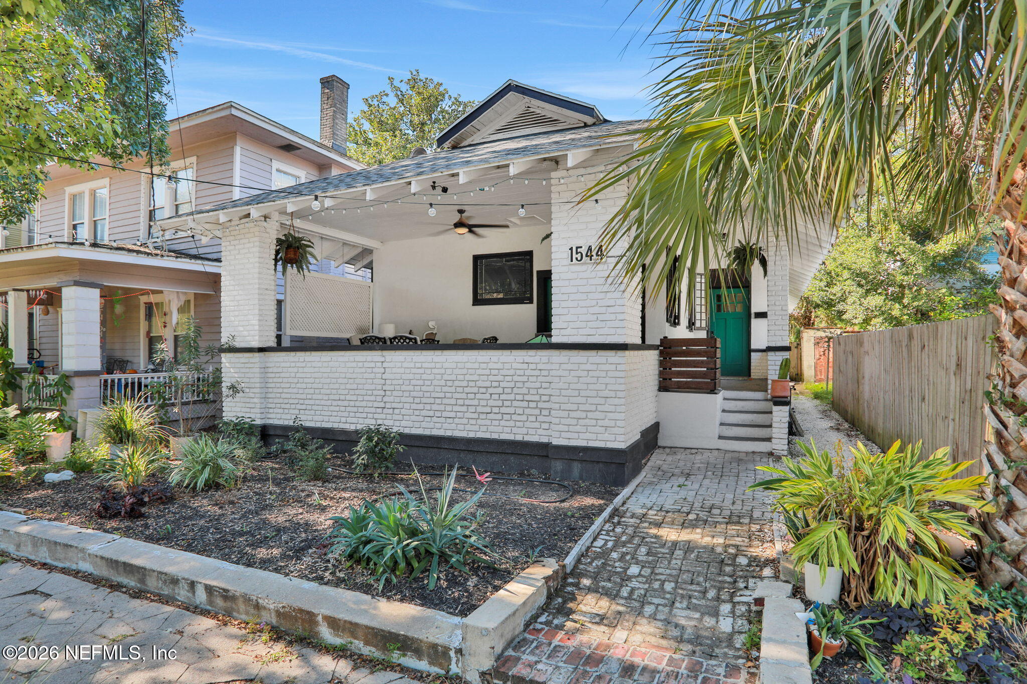 1544 Perry Street Jacksonville, FL 32206 - Photo 3 of 43 a view of a house with a small yard and wooden fence