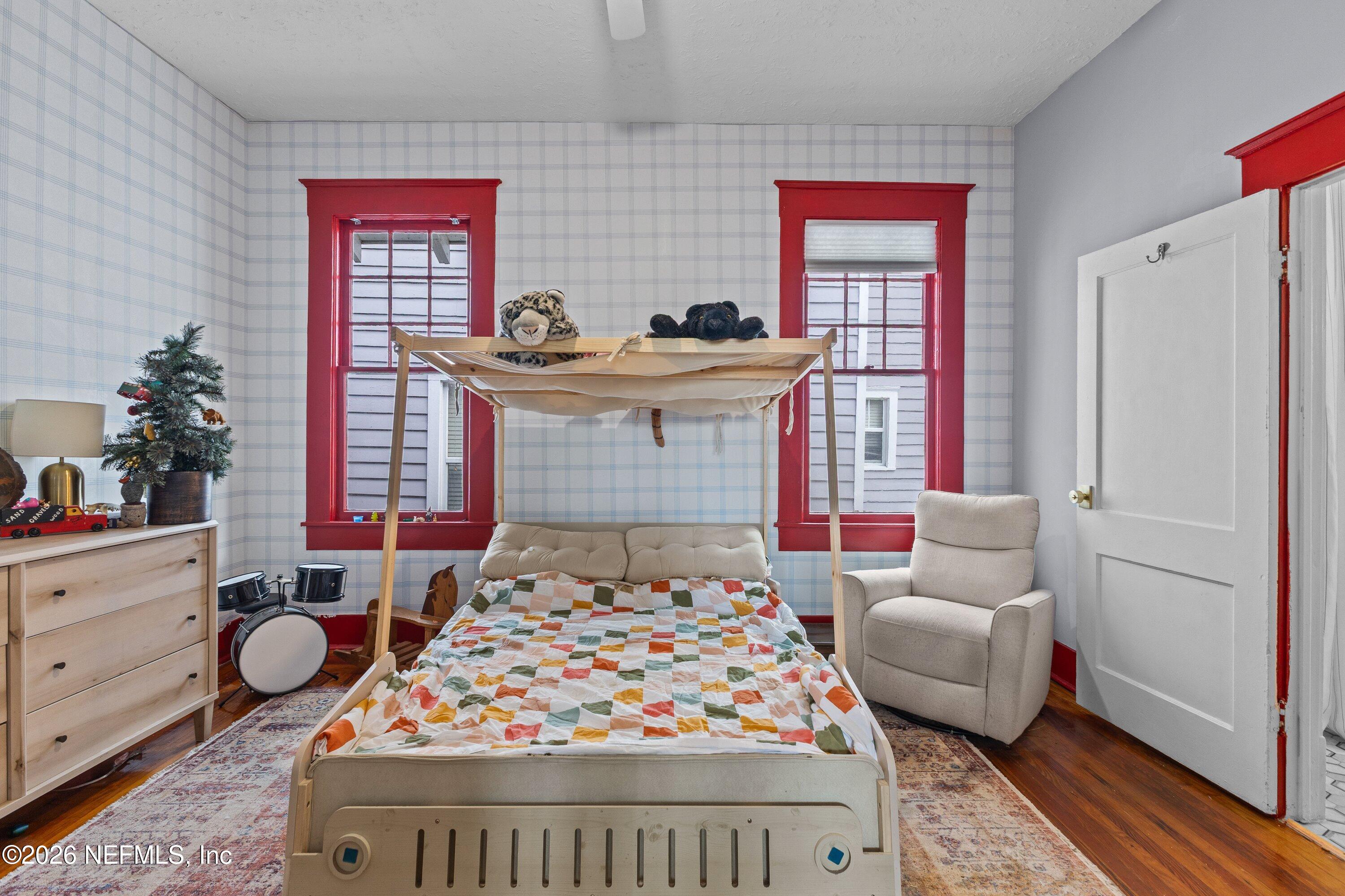 1544 Perry Street Jacksonville, FL 32206 - Photo 35 of 43 a bedroom with a bed and a dresser