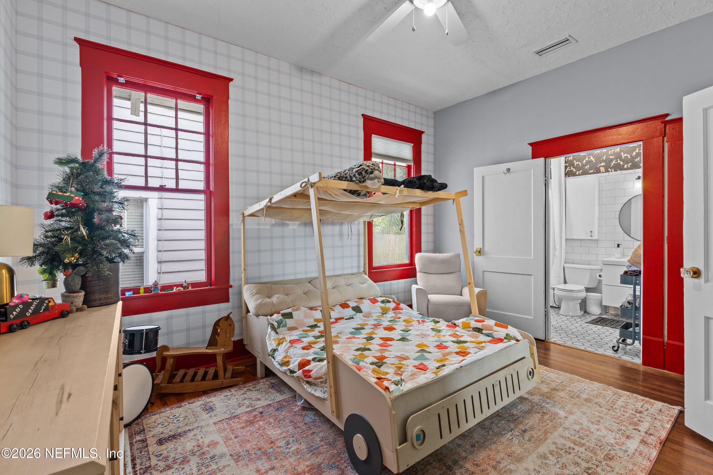 1544 Perry Street Jacksonville, FL 32206 - Photo 36 of 43 a bedroom with a bed and a window