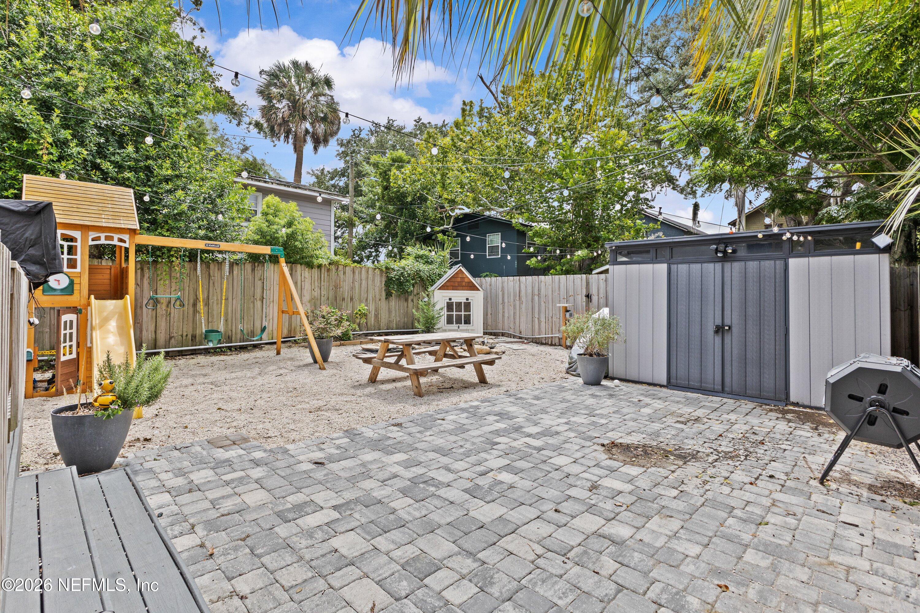 1544 Perry Street Jacksonville, FL 32206 - Photo 37 of 43 a view of backyard with a table and chair