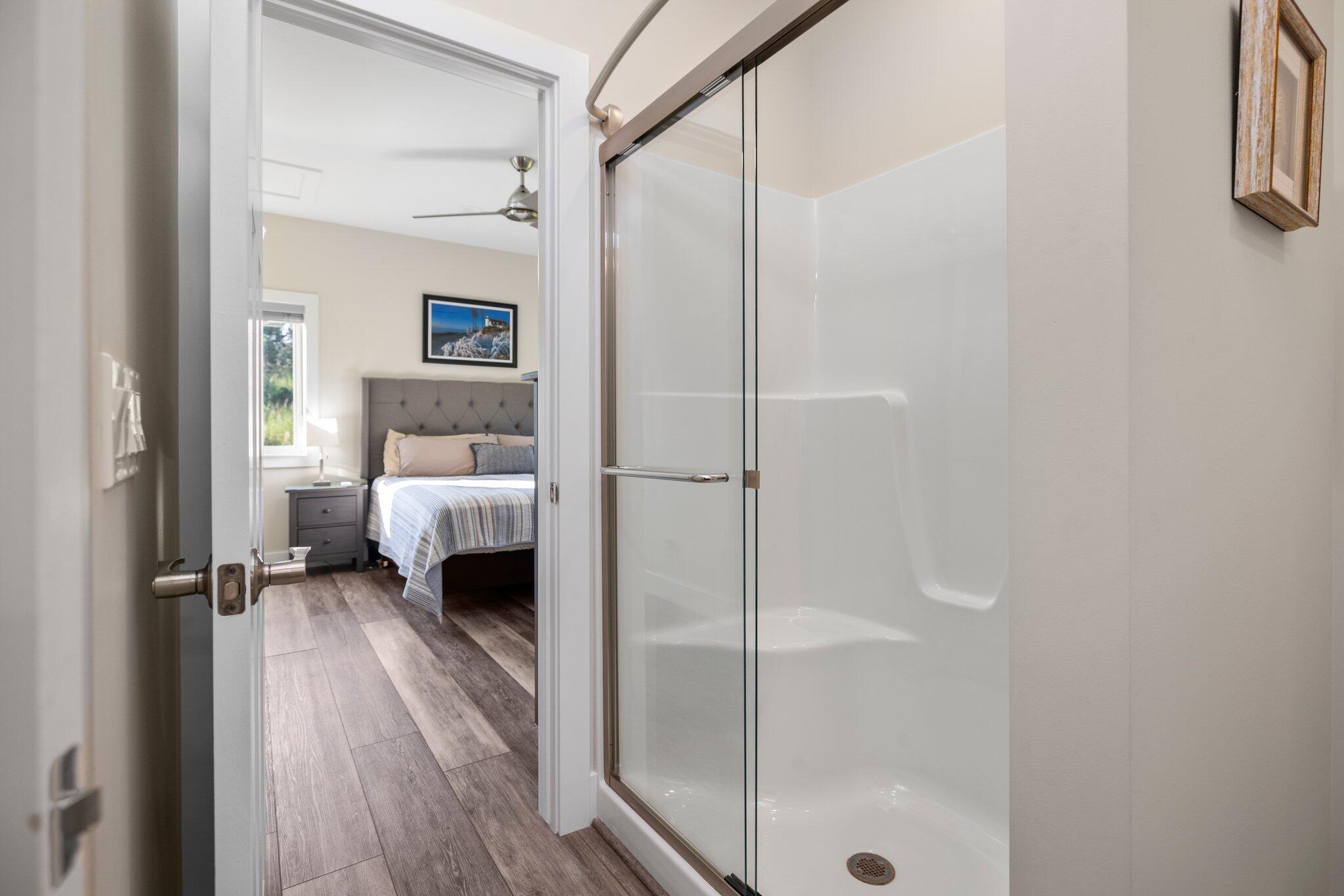 15241 Maxey Road Arcadia, MI 49613 - Photo 39 of 80 Hall bath has convenient seat in shower