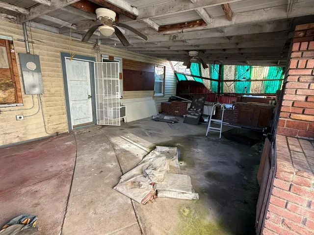a view of a room with wooden furniture