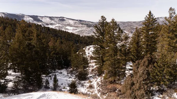 a view of mountain view with lots of trees