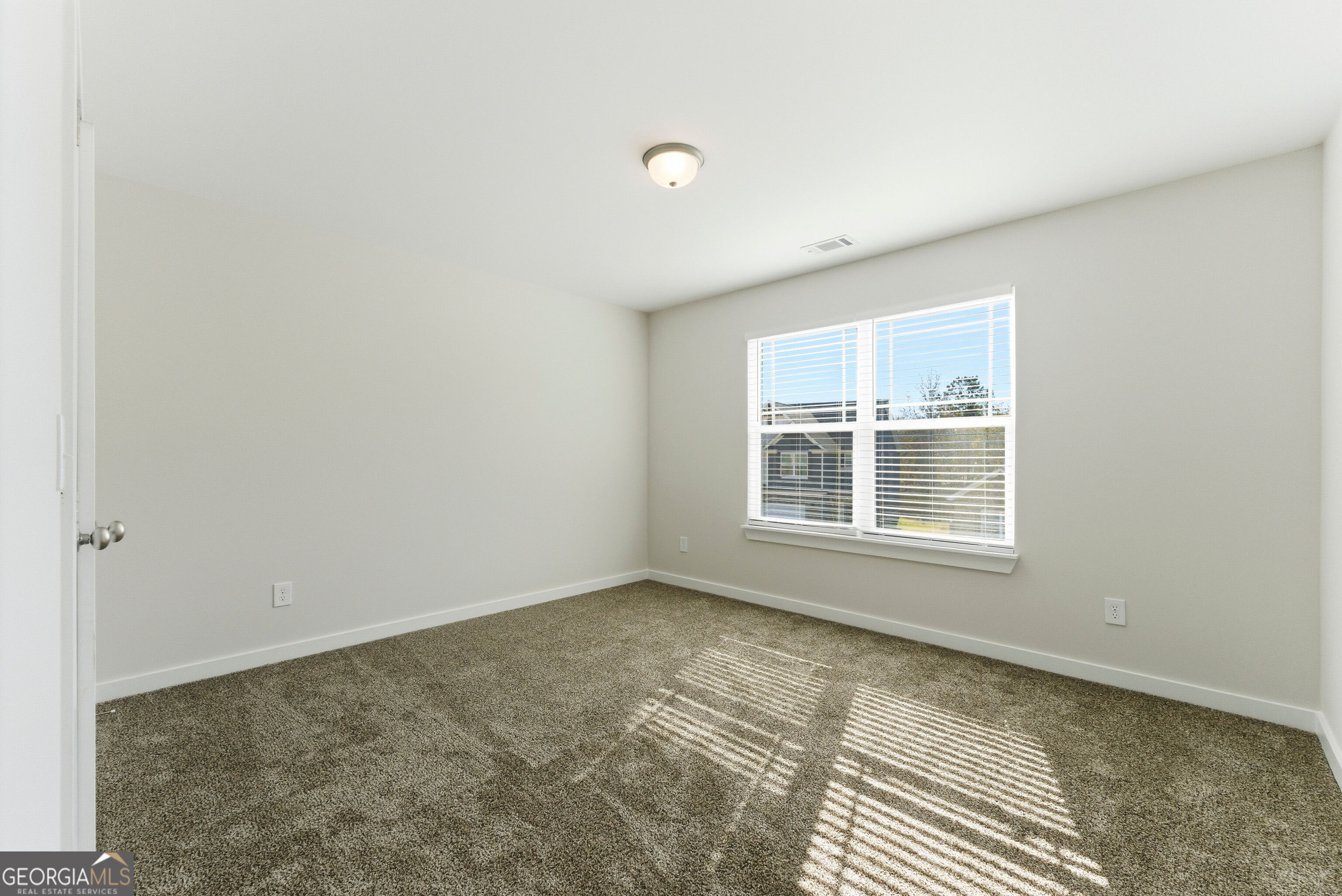 11209 Cornerstone Lane Hampton, GA 30228 - Photo 23 of 38 a view of an empty room with a window