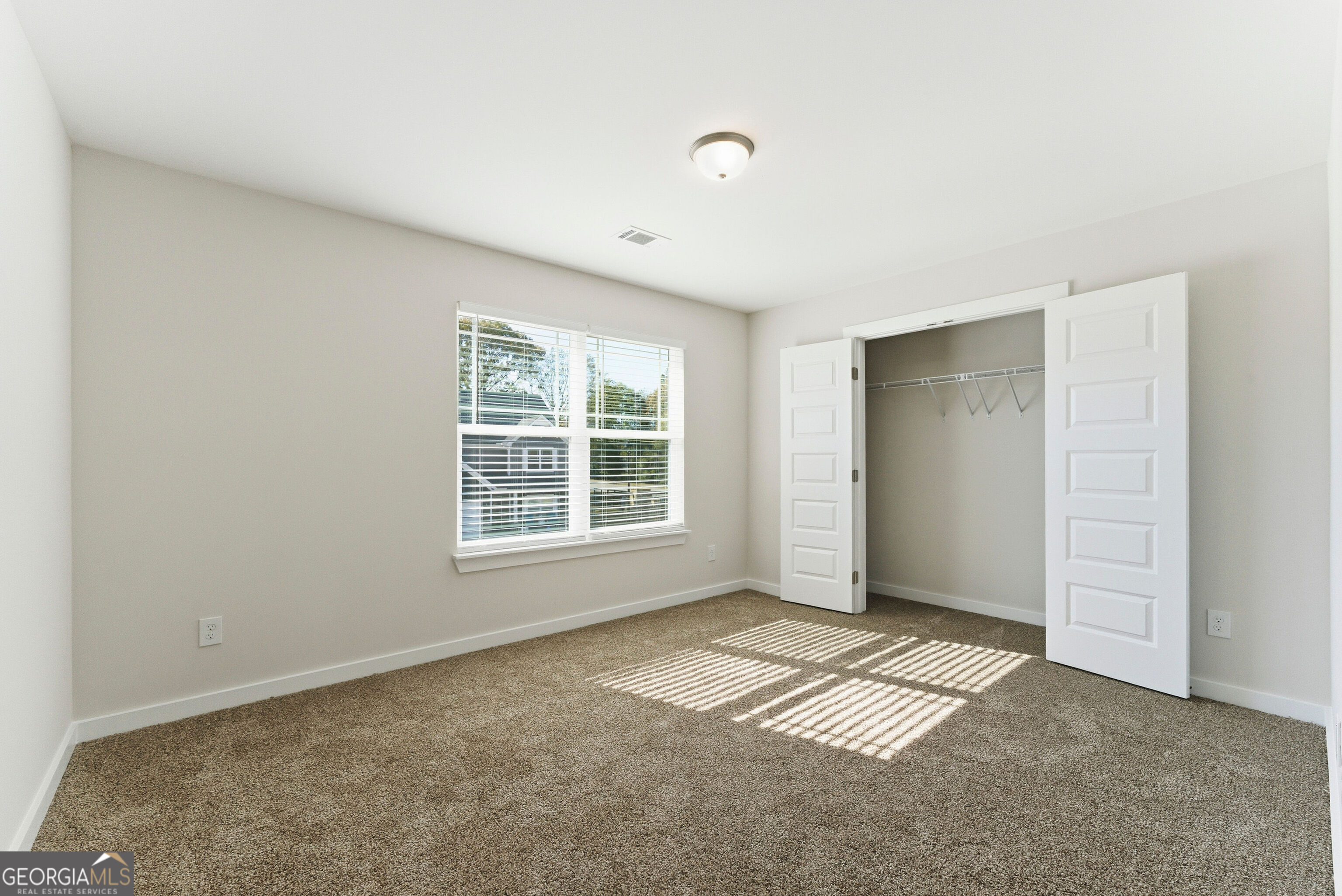 11209 Cornerstone Lane Hampton, GA 30228 - Photo 24 of 38 an empty room with windows