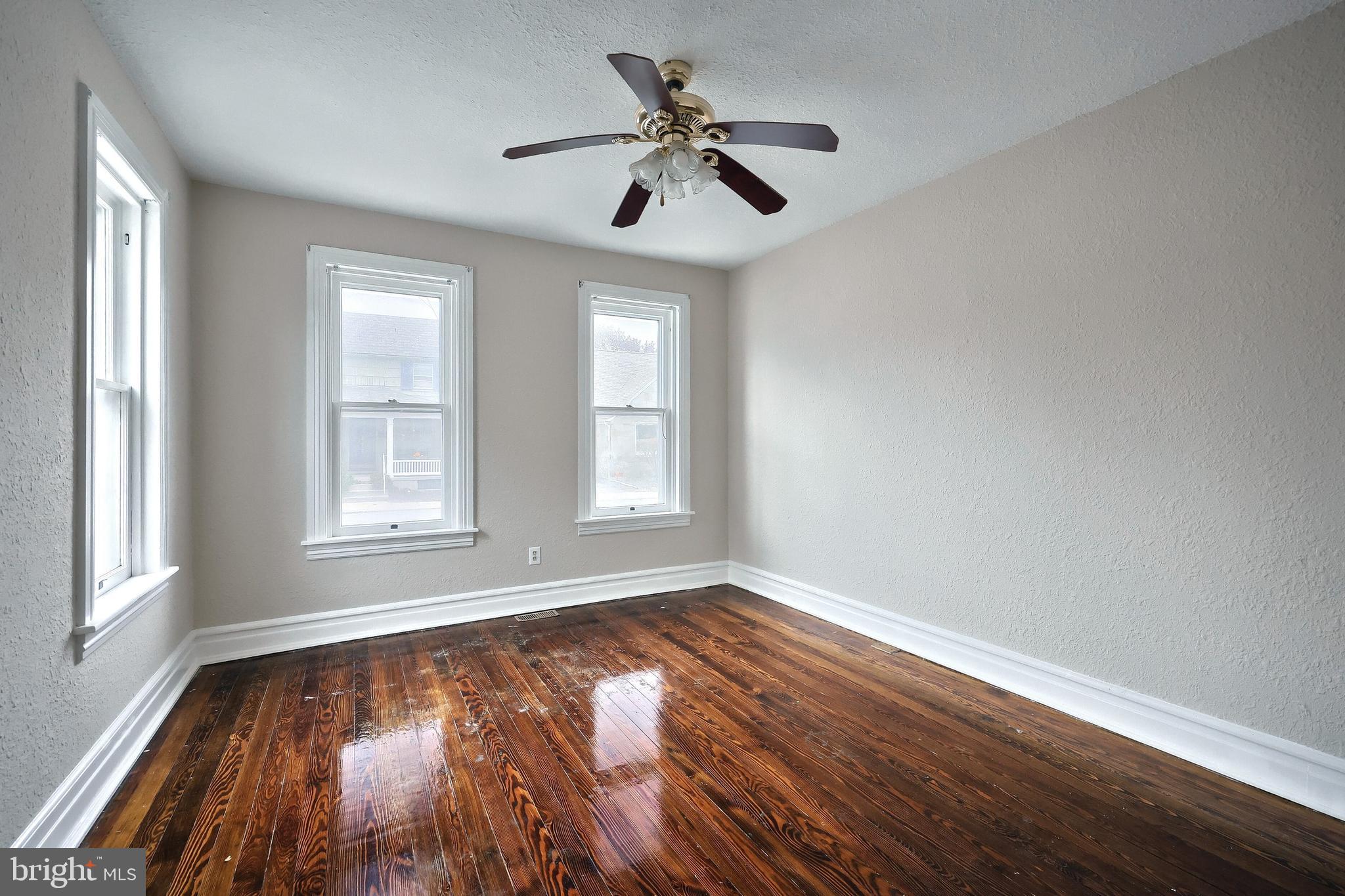 513 Stock Street Hanover, PA 17331 - Photo 11 of 30 a view of empty room with wooden floor and fan