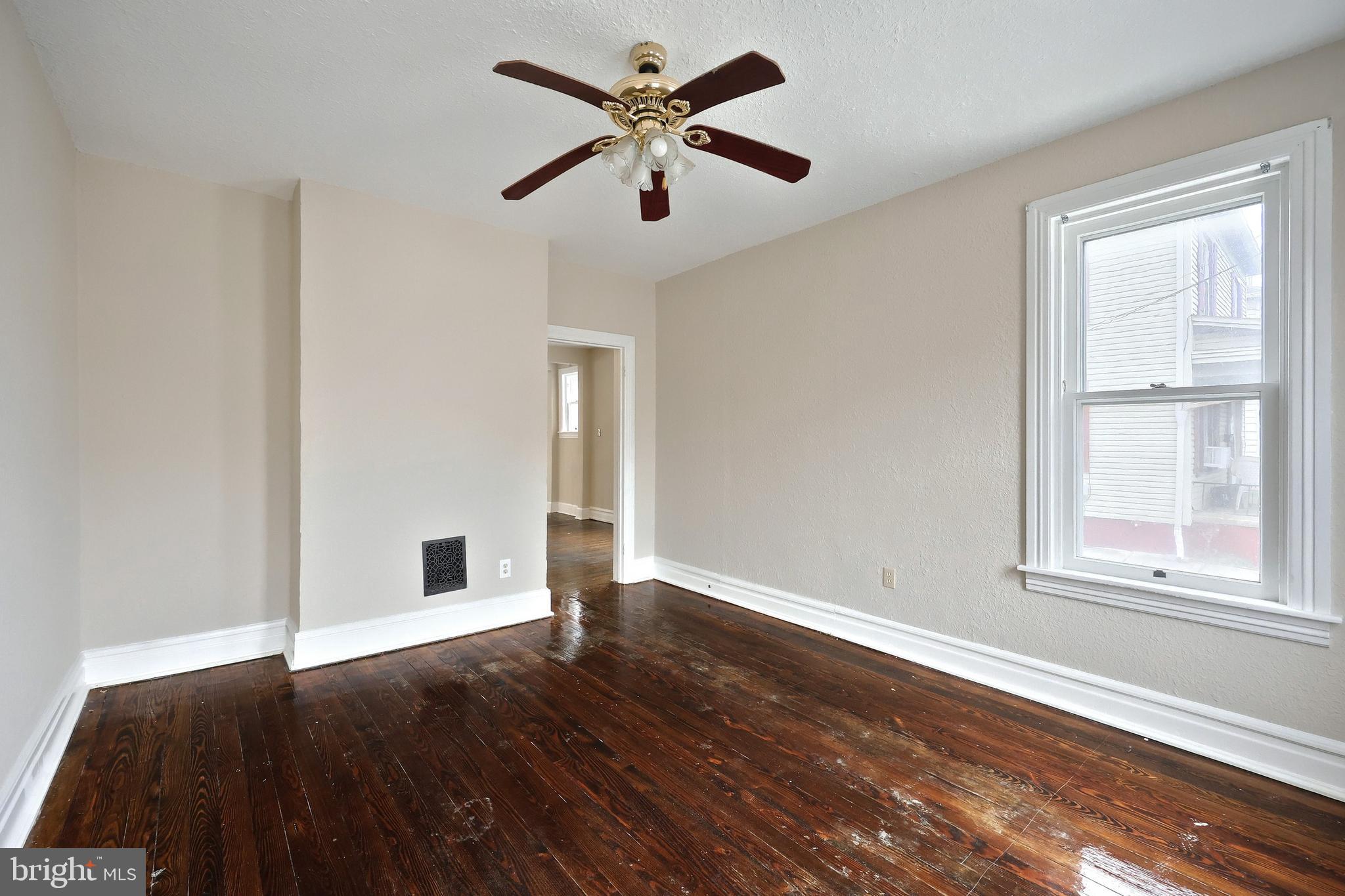 513 Stock Street Hanover, PA 17331 - Photo 12 of 30 an empty room with wooden floor and windows