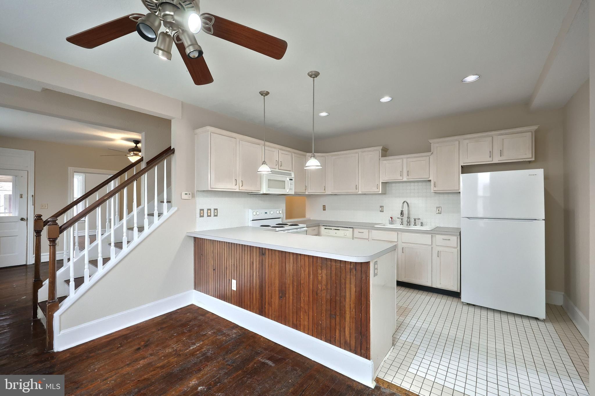 513 Stock Street Hanover, PA 17331 - Photo 15 of 30 a kitchen with kitchen island a sink stainless steel appliances and cabinets