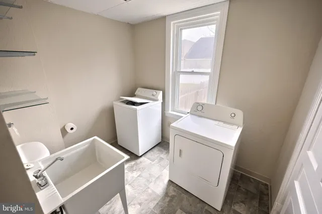 a utility room with dryer and washer