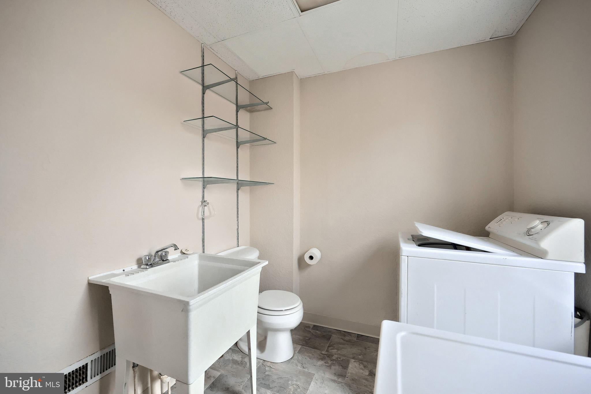 513 Stock Street Hanover, PA 17331 - Photo 20 of 30 a bathroom with a toilet a sink and a mirror