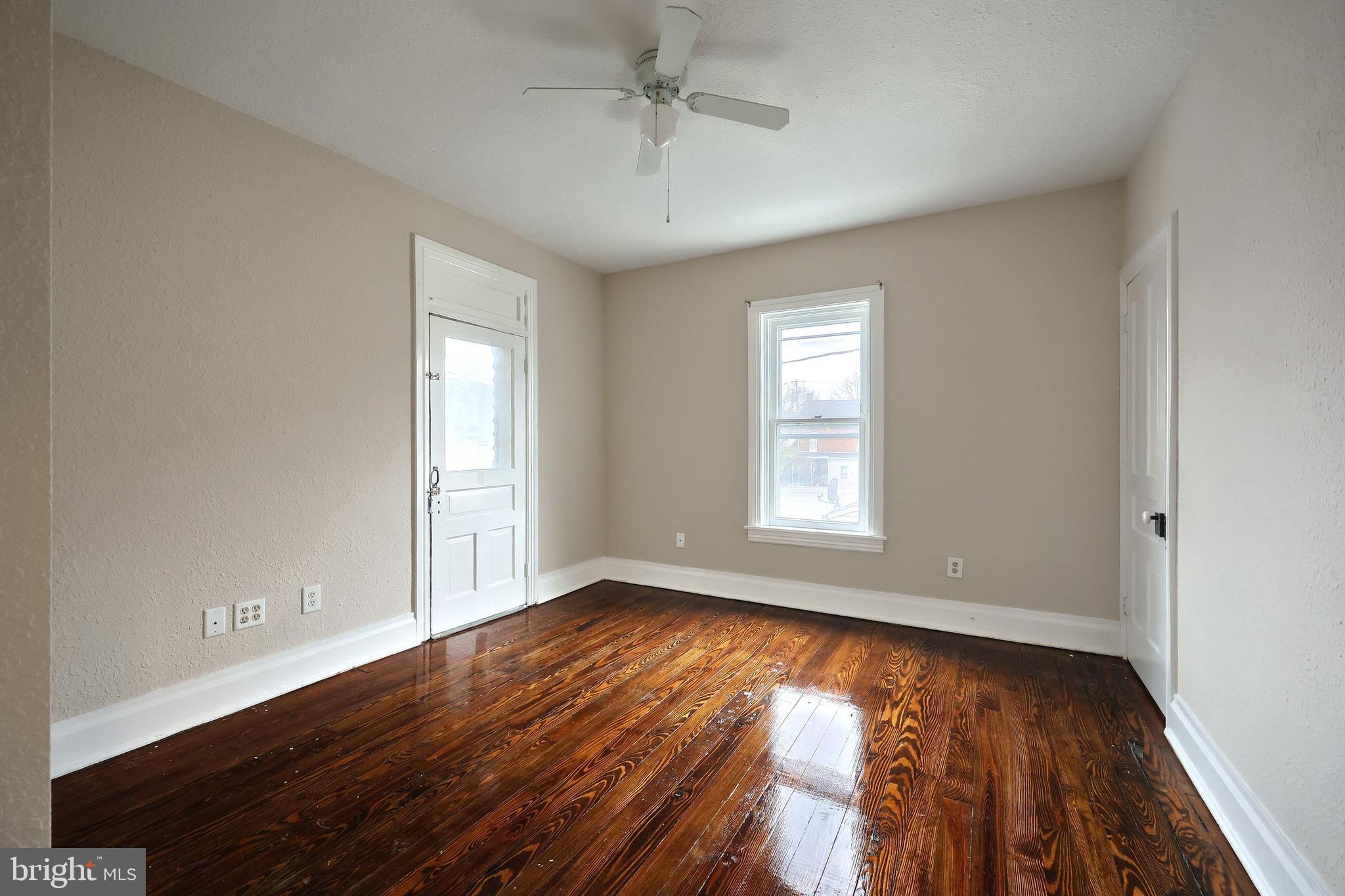 513 Stock Street Hanover, PA 17331 - Photo 25 of 30 a view of an empty room with wooden floor and a window