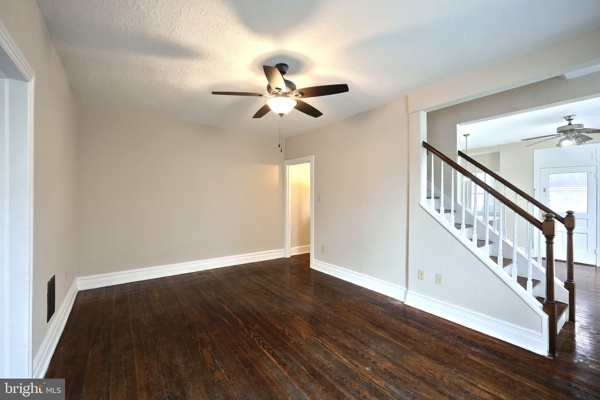 513 Stock Street Hanover, PA 17331 - Photo 7 of 30 a view of an empty room with wooden floor and a ceiling fan