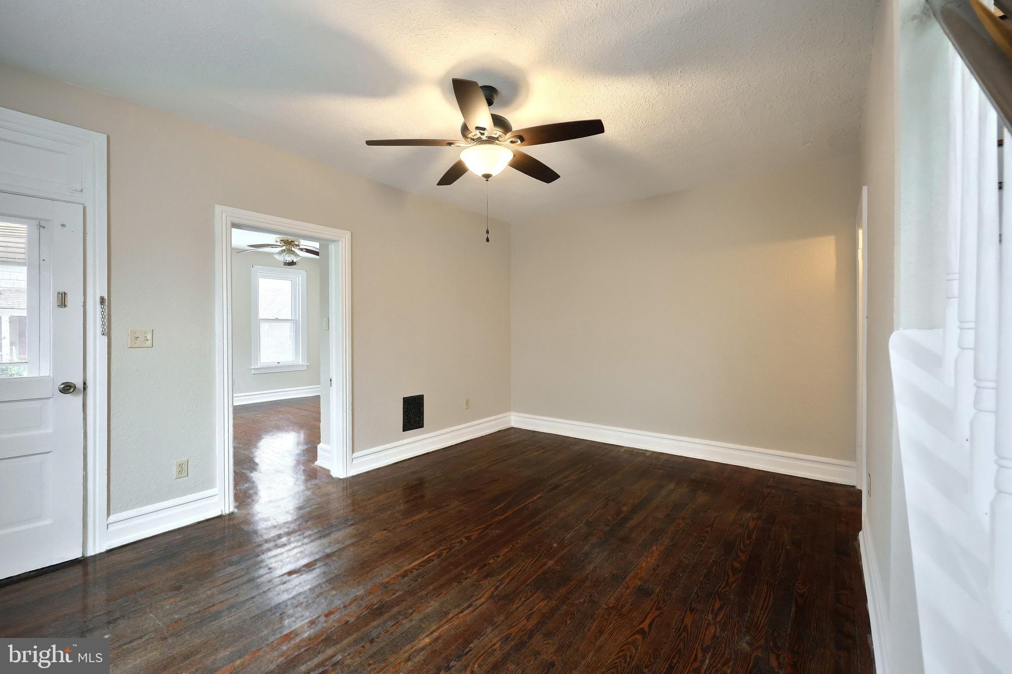 513 Stock Street Hanover, PA 17331 - Photo 8 of 30 wooden floor in an empty room with a window