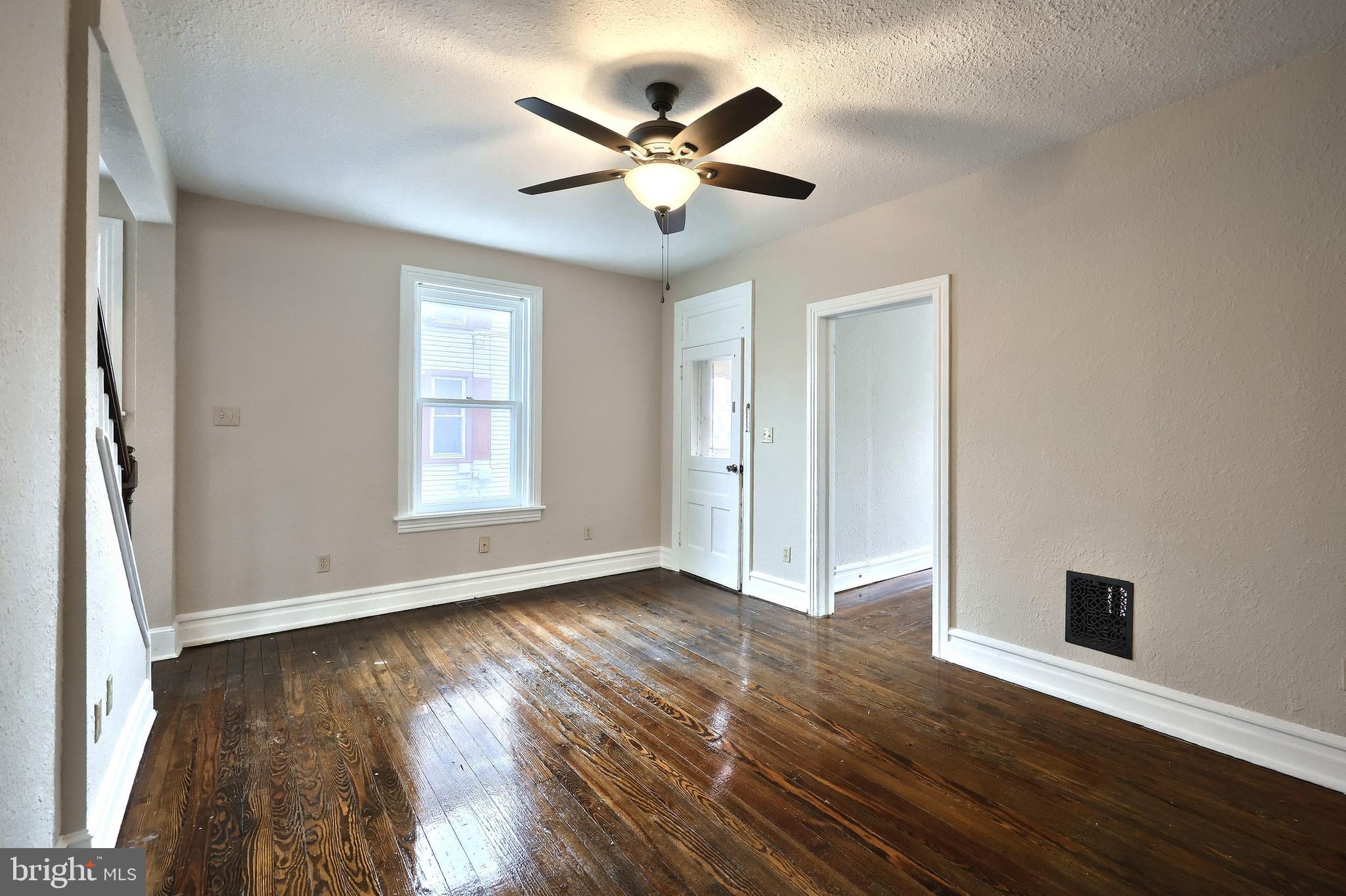 513 Stock Street Hanover, PA 17331 - Photo 9 of 30 a view of an empty room with wooden floor and a window